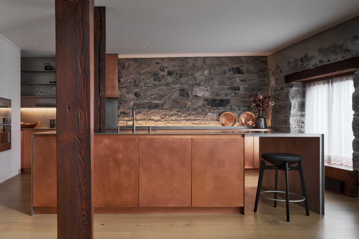 Copper Cabinets Meet Stone and Steel in a Bold Kitchen Statement