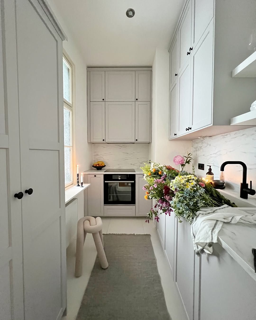 White Small Kitchen with a Simple Dining Corner Copy