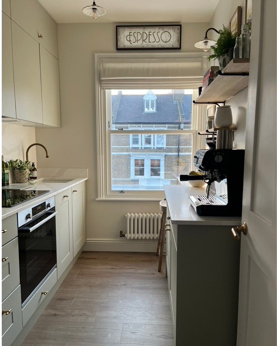 White Small Kitchen with a Simple Dining Corner Copy