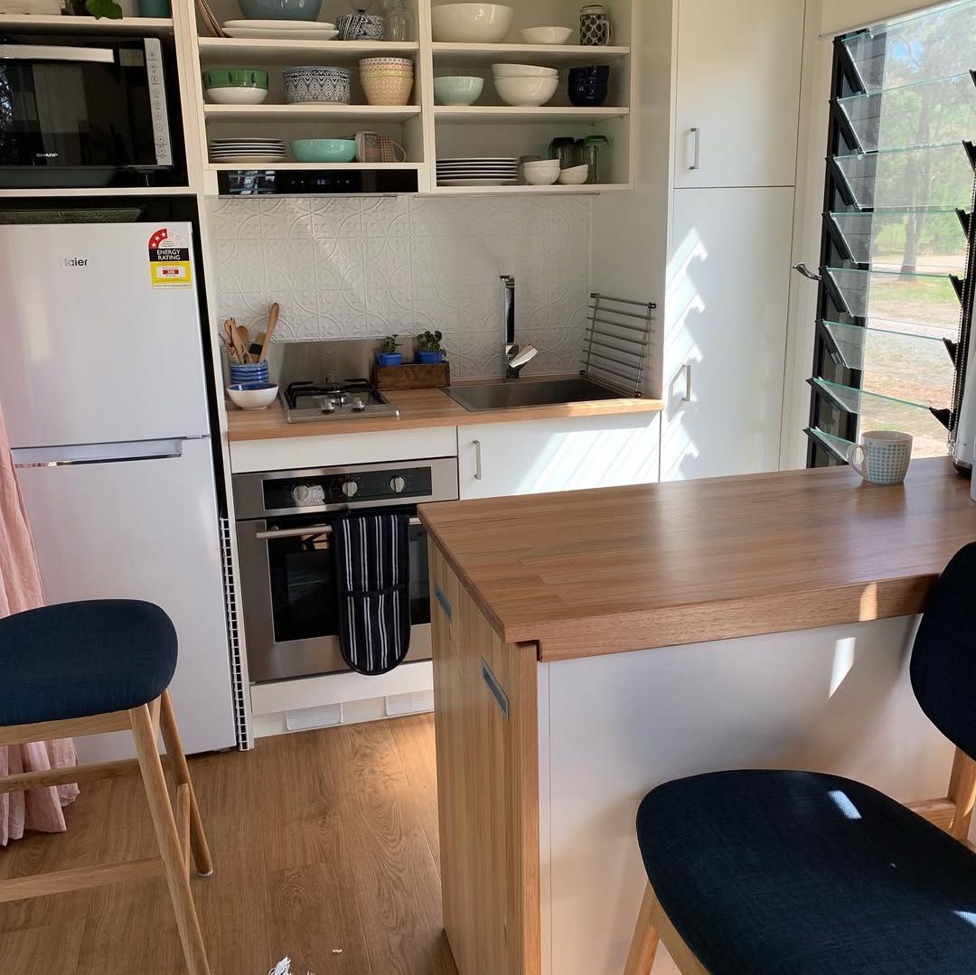 Sleek Modern Kitchen With Loft Stair Integration