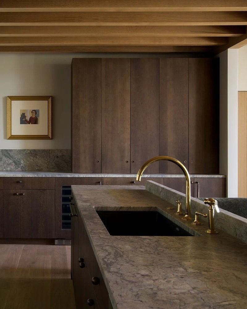 Warm Modern Kitchen with Stone and Walnut Tones