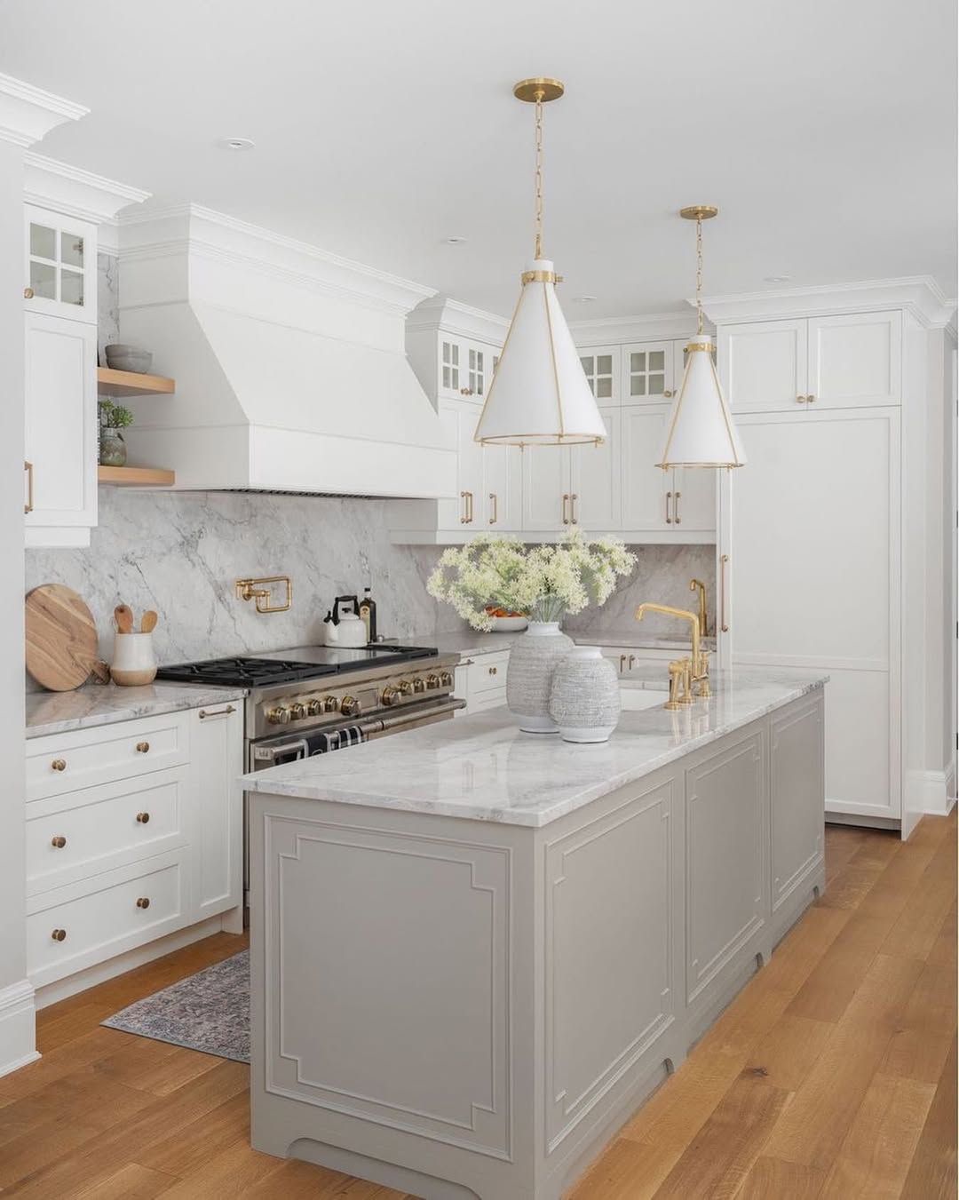 White Kitchen With Cane Stools and Patterned Tile