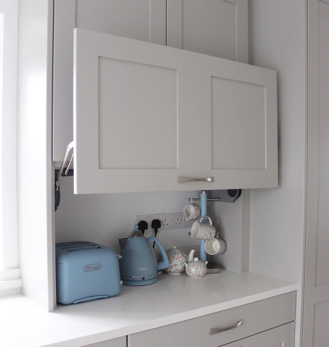 A compact appliance garage for a daily tea setup