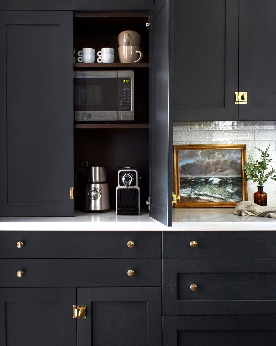 A dark appliance garage that hides more than coffee