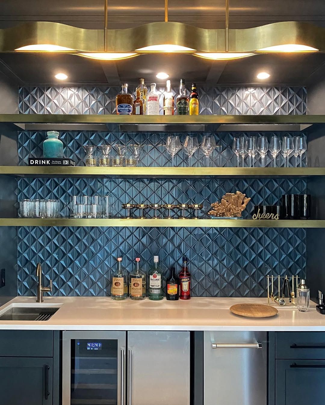Brass shelving that holds its own against patterned tile
