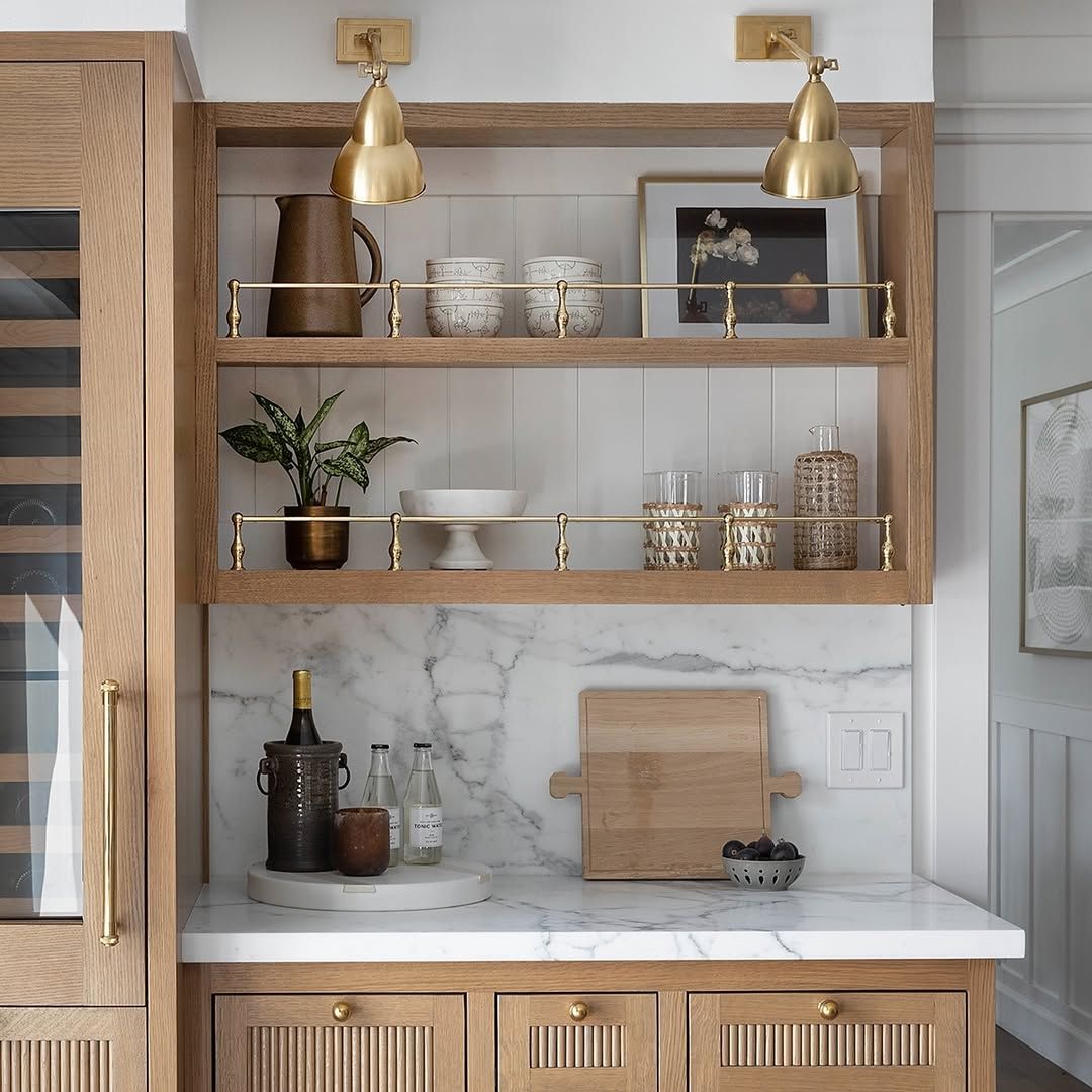Brass shelving that holds its own against patterned tile