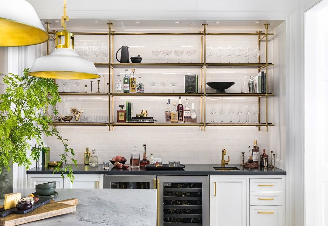 Brass shelving that holds its own against patterned tile