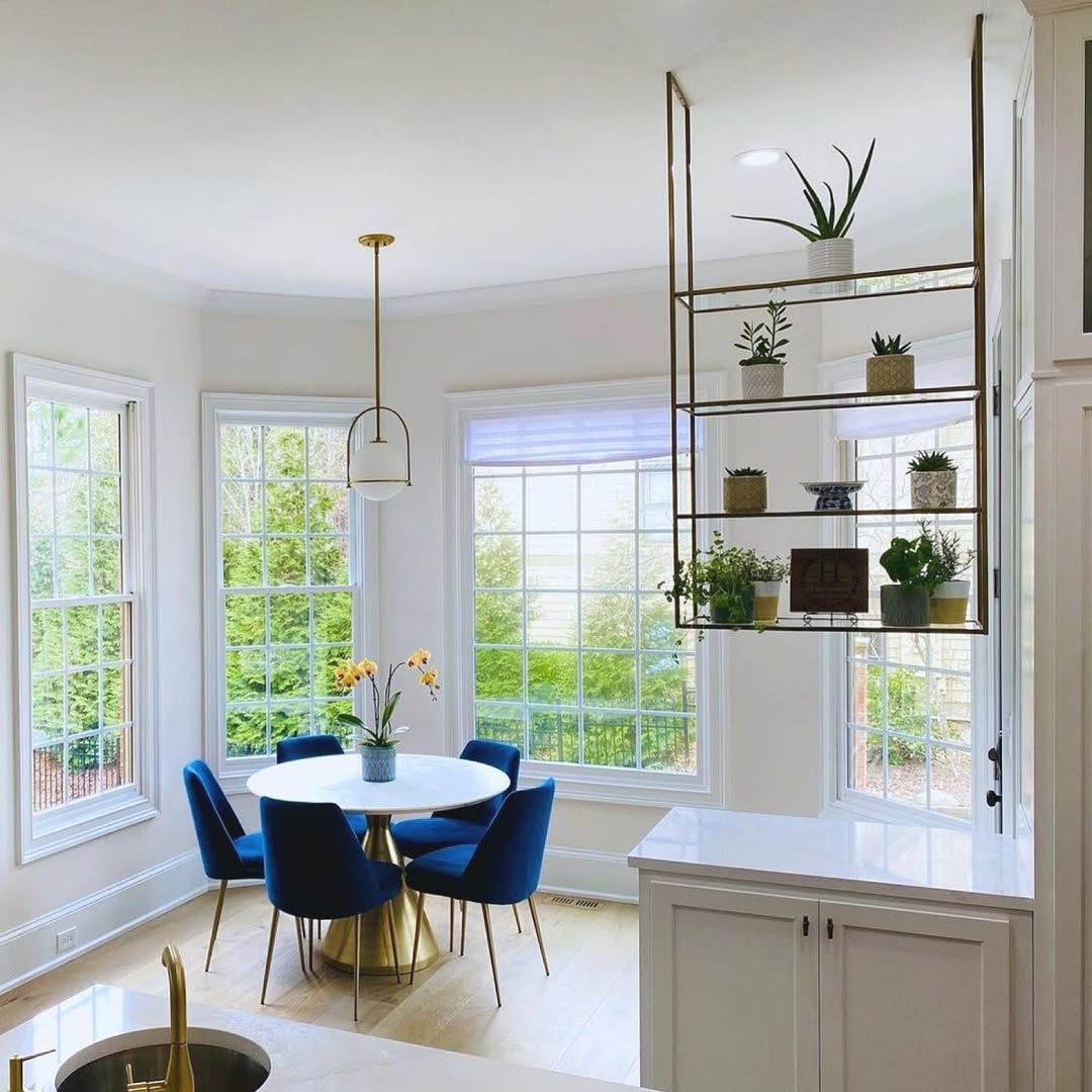 Hanging glass shelves that act as soft room dividers