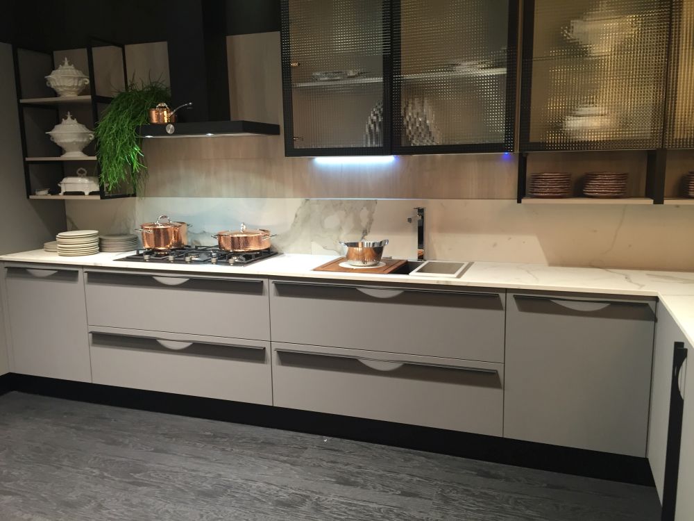 Solid lower cabinets paired with glass-front upper storage