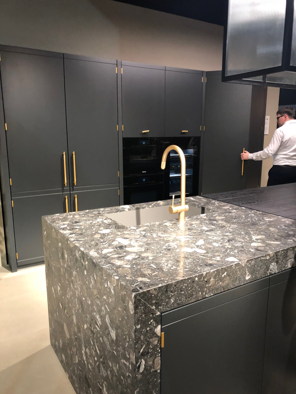 Terrazzo-style islands and charcoal towers