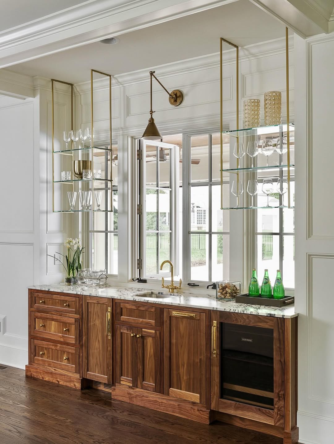 Glass shelves used as architectural frames rather than storage walls